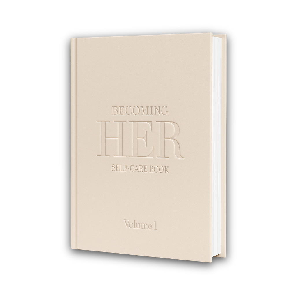 A minimalist beige hard-cover book titled “Becoming Her: Self-Care Book – Volume 1.” The design features embossed lettering on a matte textured cover, embodying a quiet-luxury aesthetic that reflects themes of self-care, femininity, and personal growth.